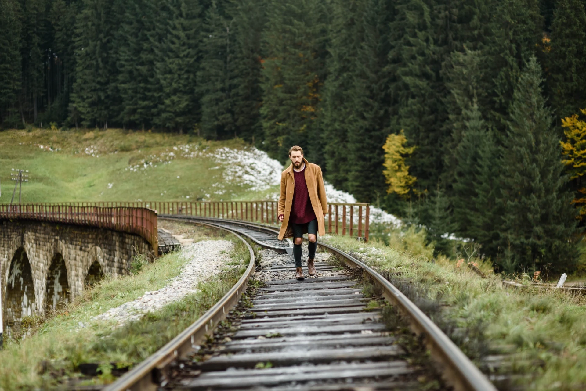 Person Standing on Railroad